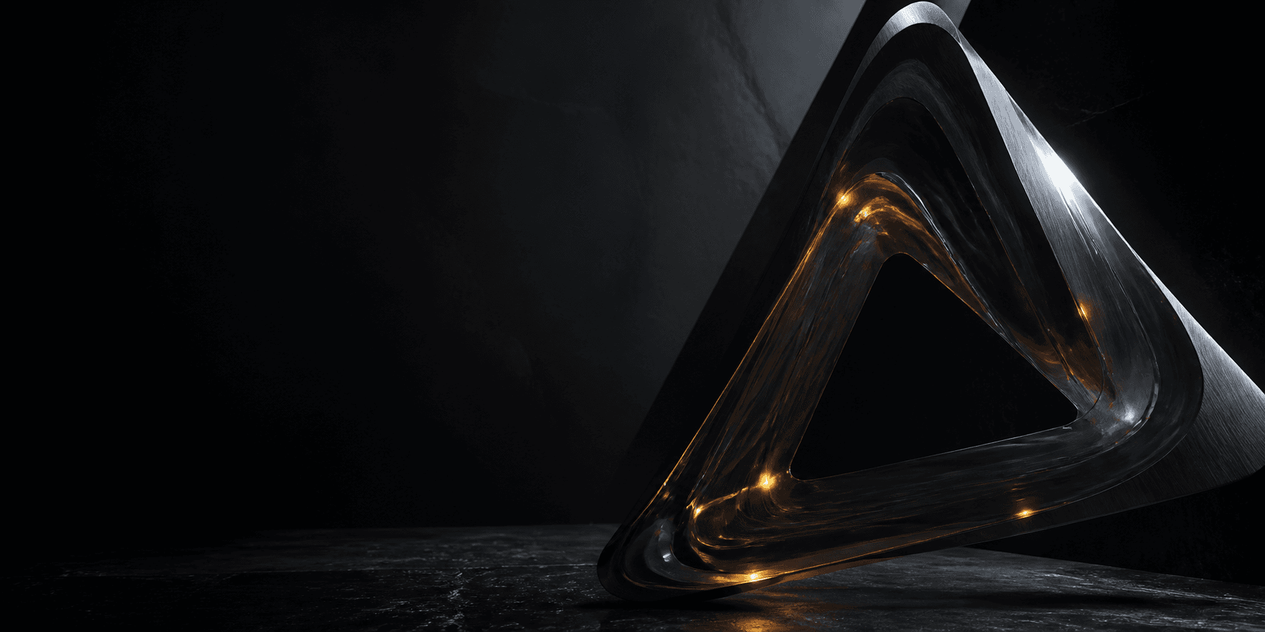 A sculptural triangular form in black glass and dark metal, illuminated by amber signal points.